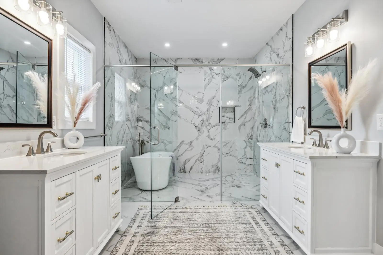 Refined primary bathroom delivered by OMA Homes